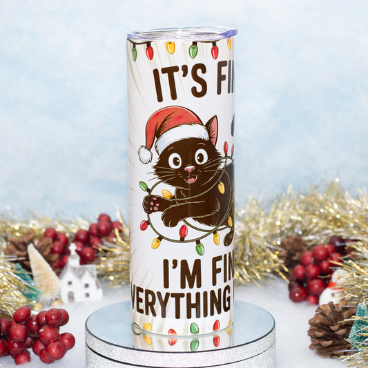 A tall white insulated tumbler with a clear lid, printed with a black cat wearing a red Santa hat and surrounded by Christmas lights,