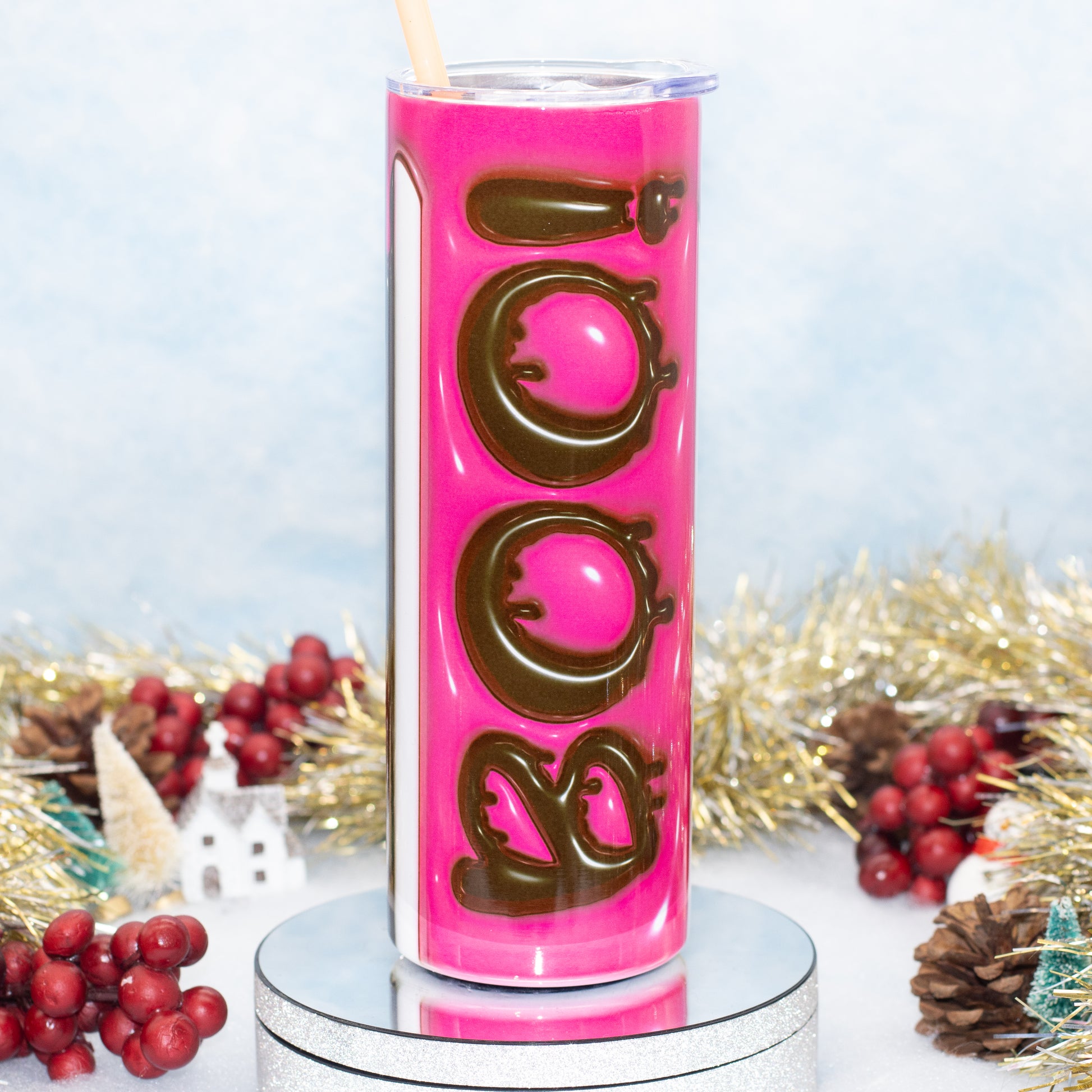 A tall, insulated tumbler with a clear lid and straw,