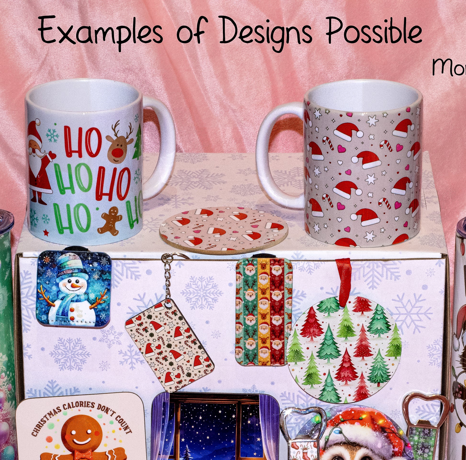 A collection of Christmas-themed mugs and matching accessories displayed on a box against a pink fabric backdrop. The mugs feature holiday prints including Santa, reindeer, candy canes, and snowflakes, with the text 'Examples of Designs Possible' at the top.