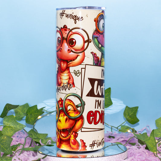 A custom printed tumbler cup featuring cartoon dinosaur characters wearing glasses 
