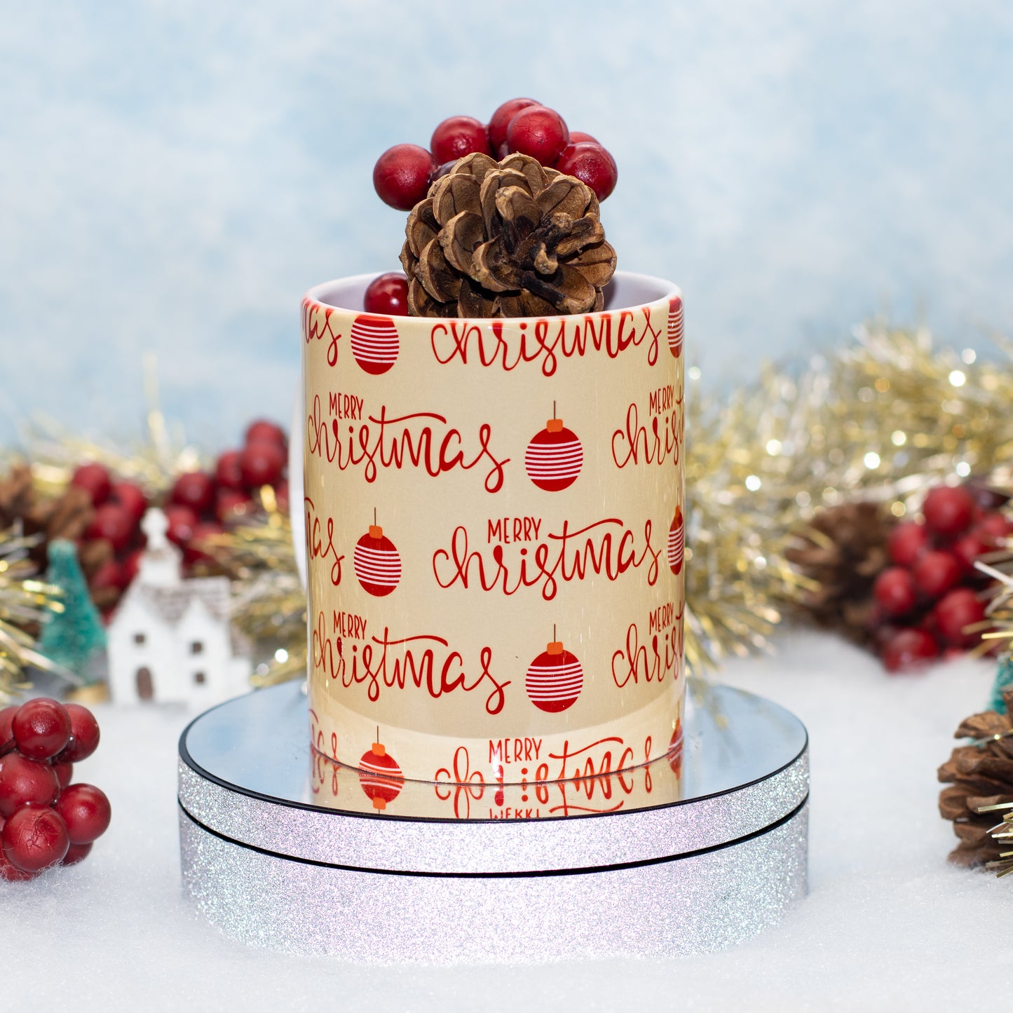 A ceramic White mug with MERRY CHRISTMAS and babbles on a beige background