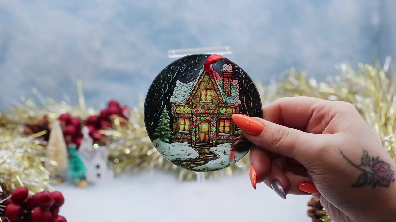 Video showcasing a glass frosted Christmas ornament featuring a gingerbread scene