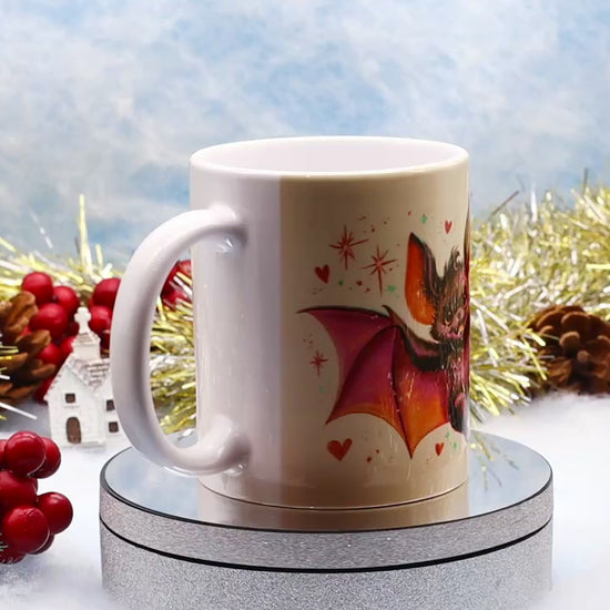 Video showcasing a white ceramic mug with cute cartoon bat 