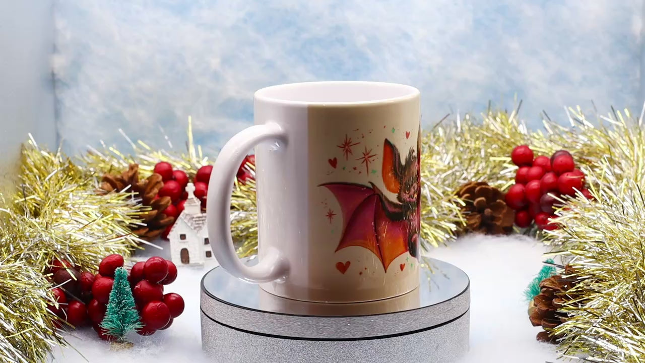 Video showcasing a white ceramic mug with cute cartoon bat 