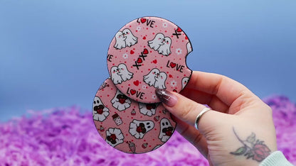 Video showcasing two car coasters with valentine day ghosts