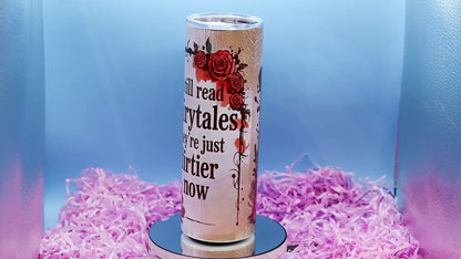 video showcasing A tall insulated tumbler with a clear lid, featuring the printed phrase 'I still read fairytales they're just dirtier now' 