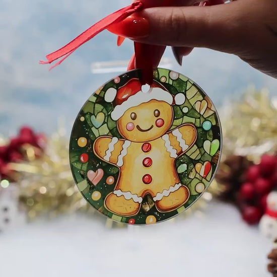 Video showcasing a glass frosted Christmas decoration with a gingerbread scene